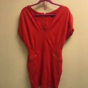 Red French Connection dress with gold zippers.